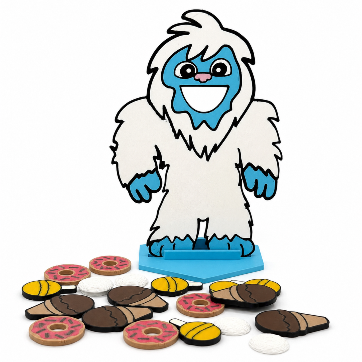Close-up of the Feed the Yeti speech therapy game showing miniature treats and handcrafted details