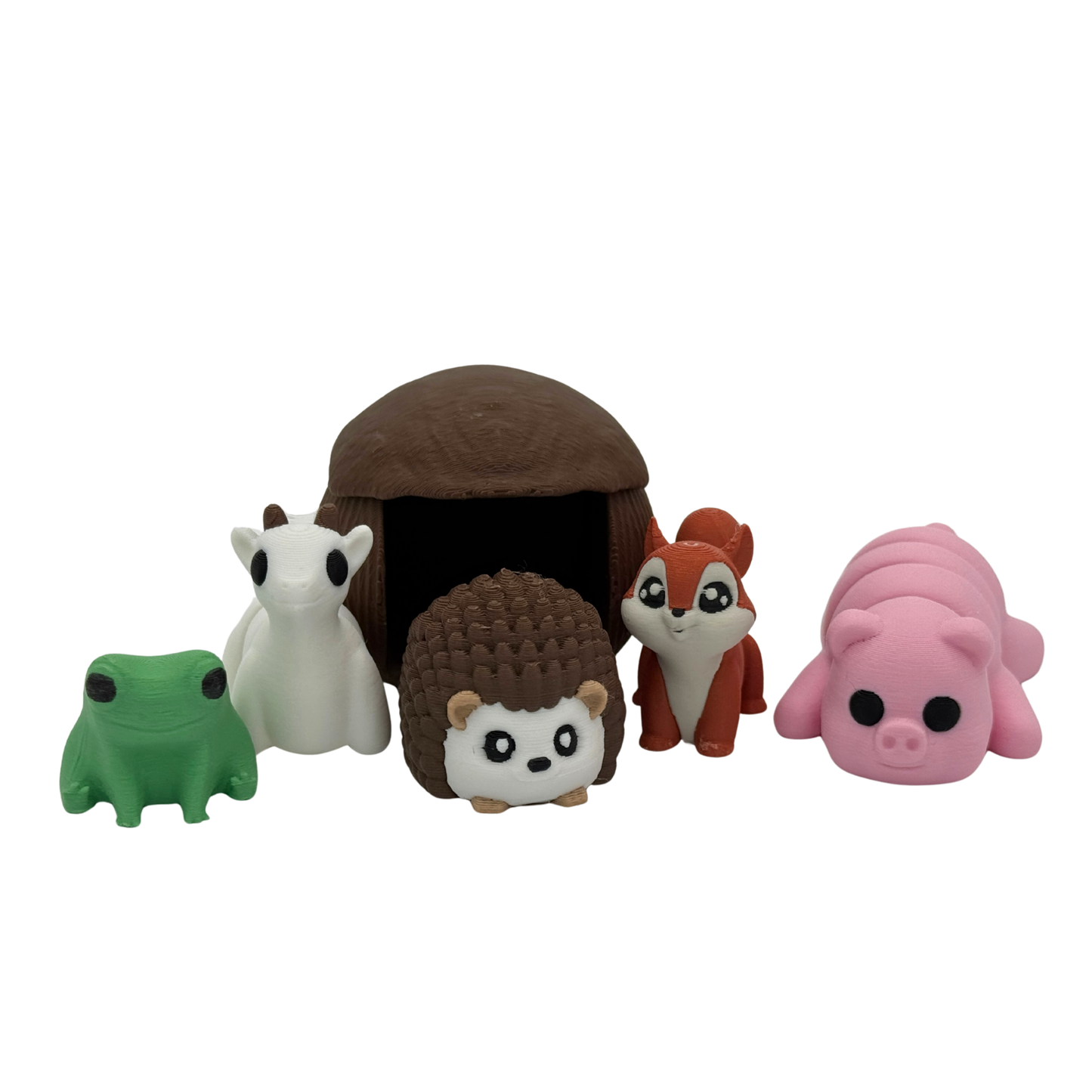Close-up of hedgehog and animal miniature figures including pig, squirrel, frog, and goat with accessories