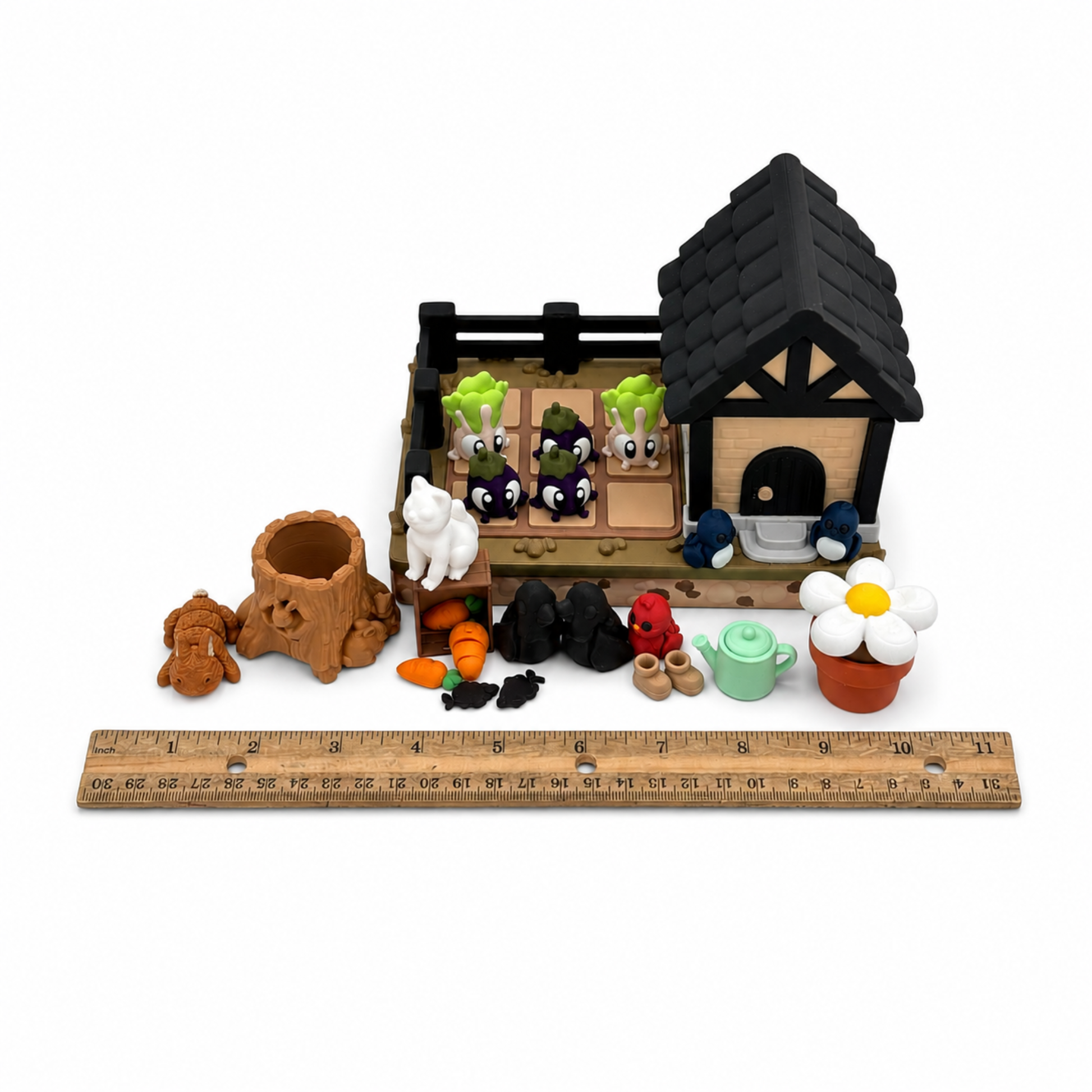 Rabbit garden miniature play set shown with ruler for size reference including garden shed, vegetable garden, woodland animals and sensory play accessories.