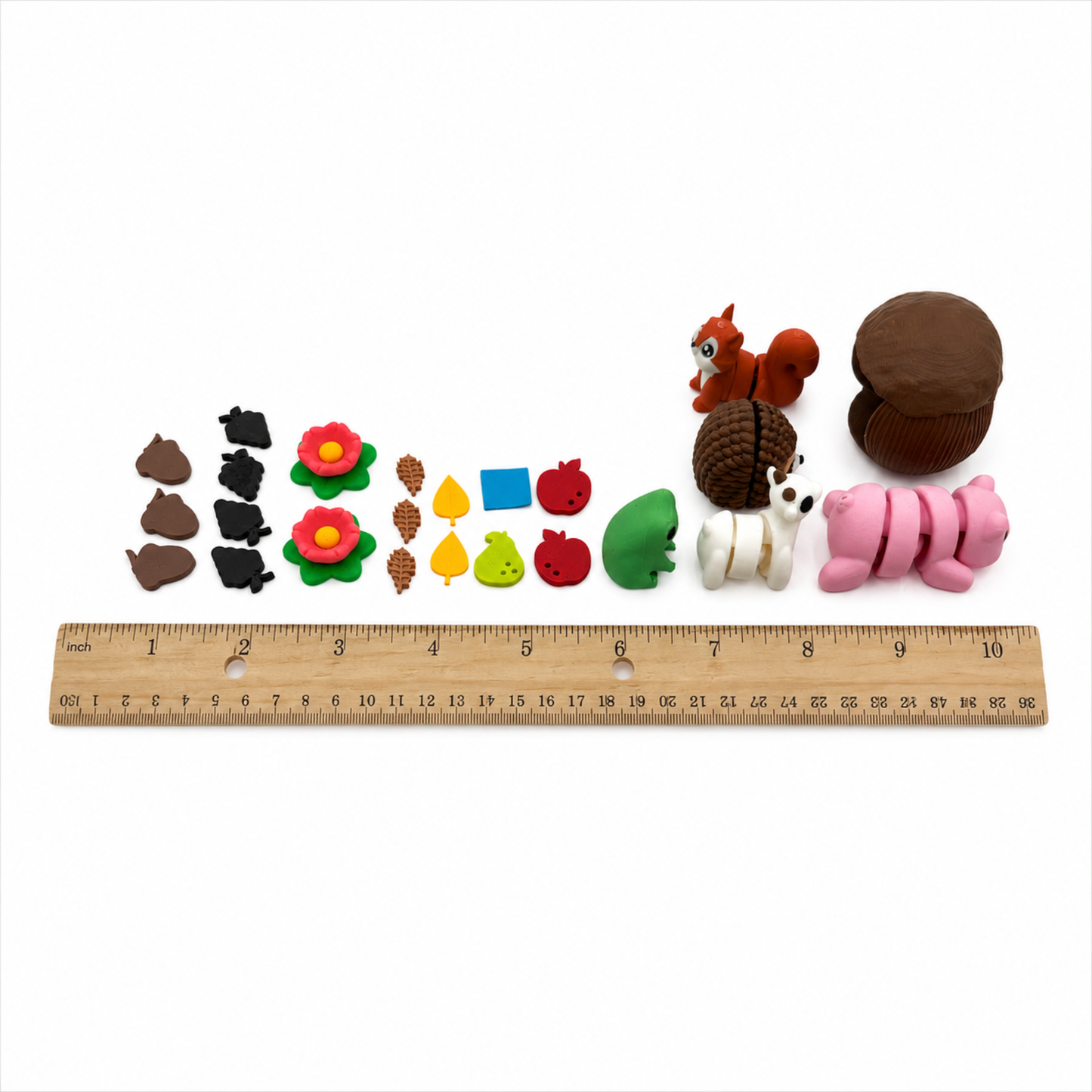 Hedgehog and Friends miniature woodland pieces displayed beside a 12-inch ruler to show product size and scale.
