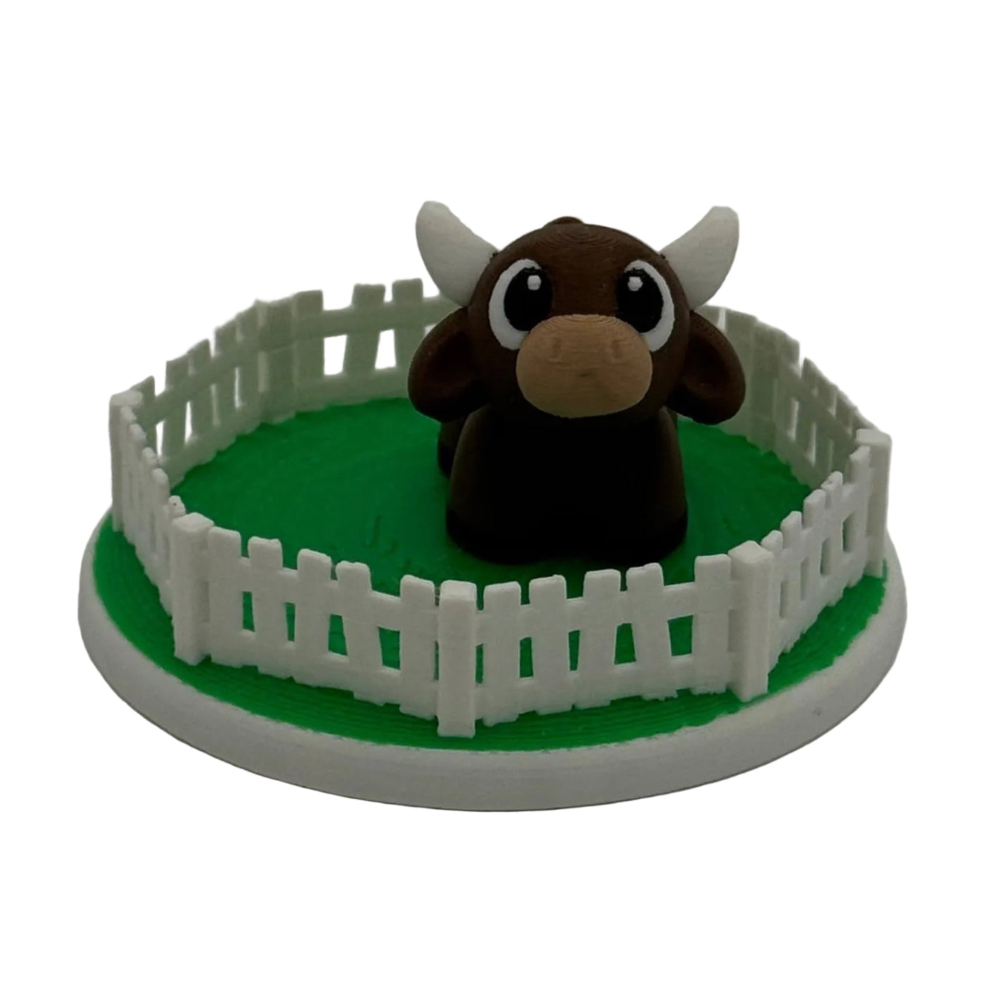 Fenced pasture and brown cow miniature