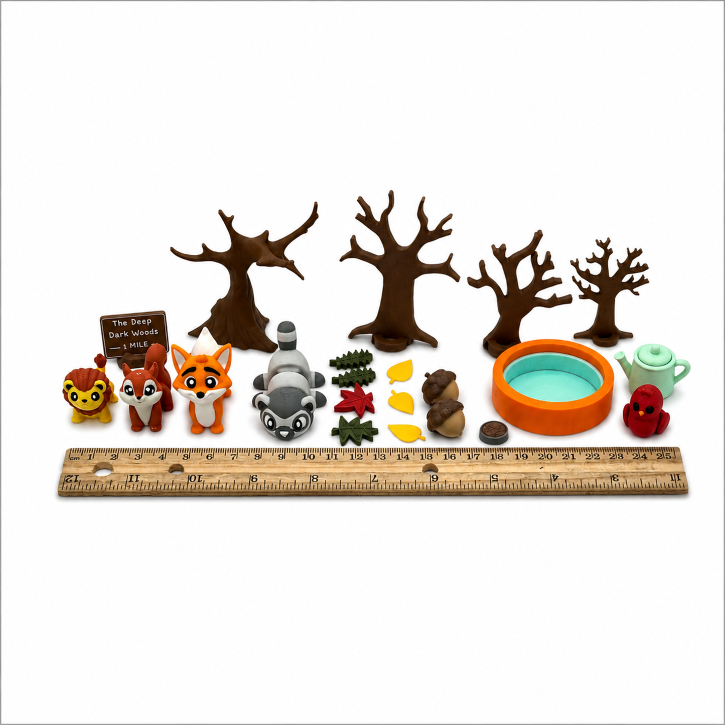 Woodland animal miniature play set shown with ruler for accurate size reference and product measurements