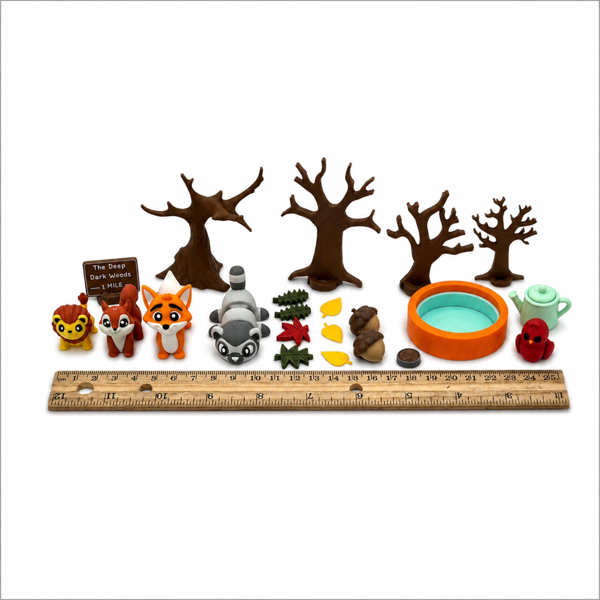 Woodland animal miniature play set shown with ruler for accurate size reference and product measurements