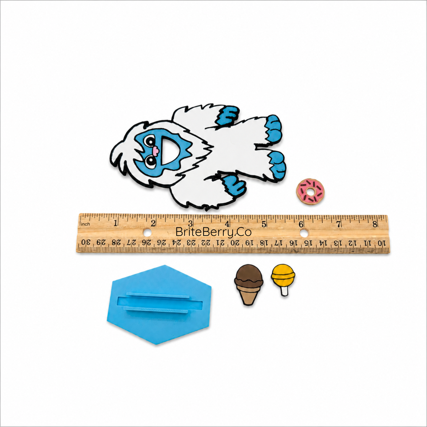 Feed the Yeti miniature speech therapy game shown with ruler for size reference and product dimensions
