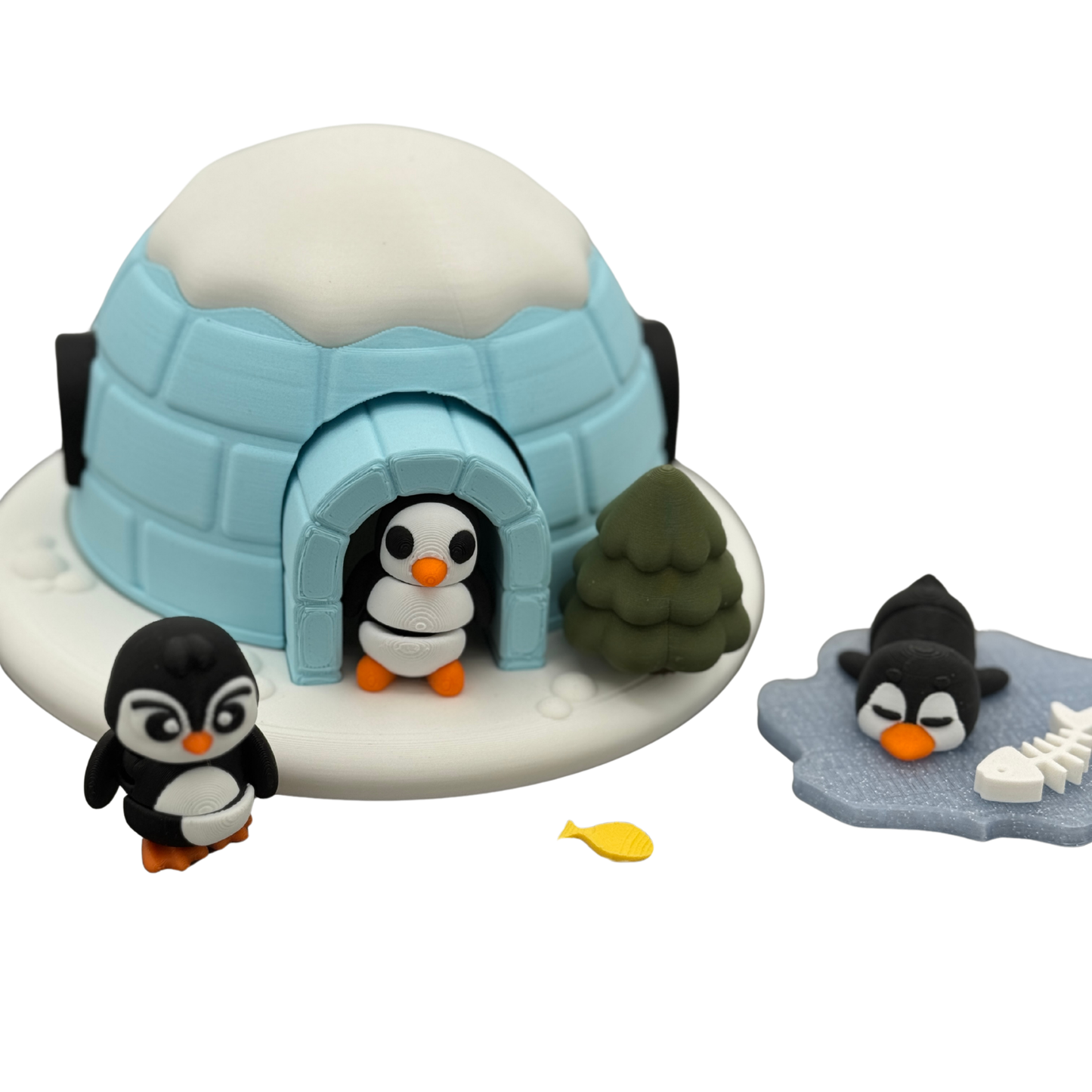 Front view of penguin igloo play set with miniature penguins and accessories