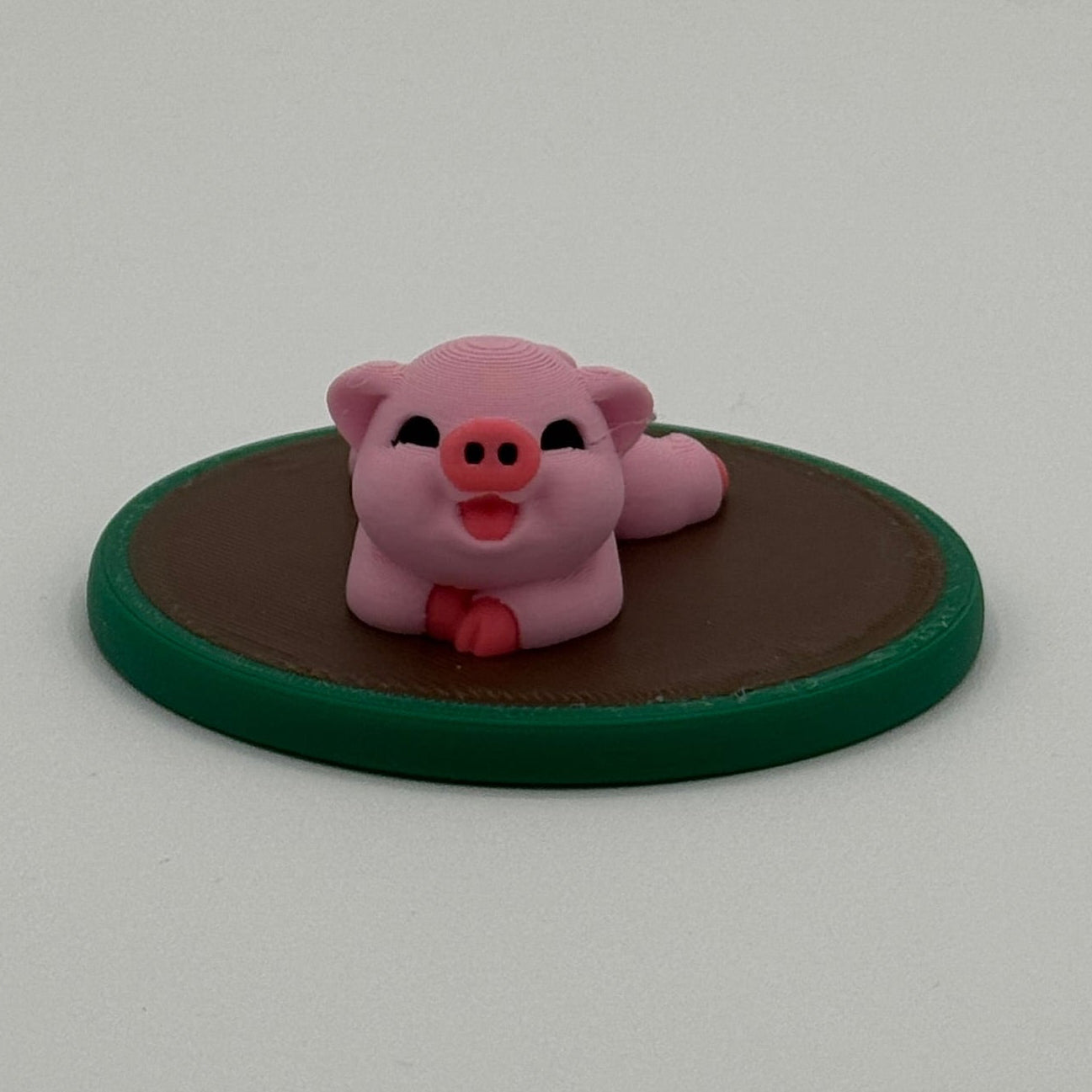 Small 3D printed pig figurine on green base, farm animal miniature for imaginative play
