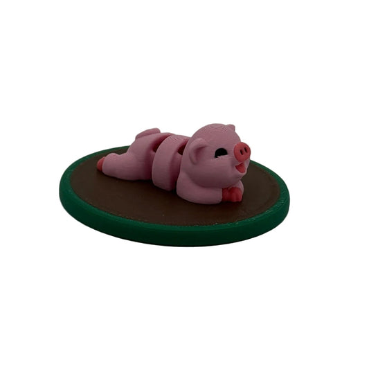 3D printed pig miniature resting in a muddy puddle base, farm animal playset for sensory bins and pretend play