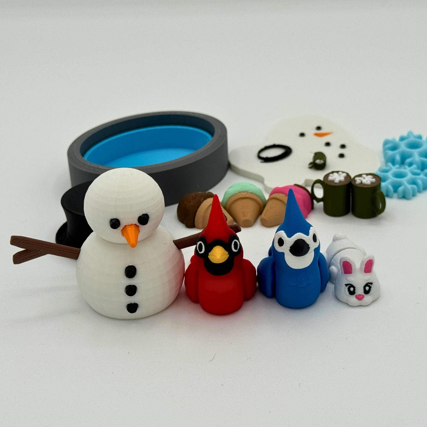 Winter-themed small world play scene with snowman characters and accessories designed for story retelling and imaginative play
