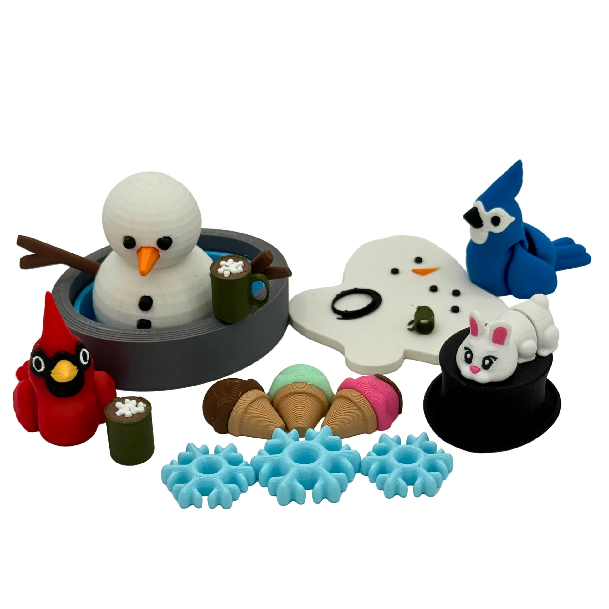 3D printed winter storybook character set featuring snowman figures, animal friends, and small winter accessories arranged for guided play and storytelling