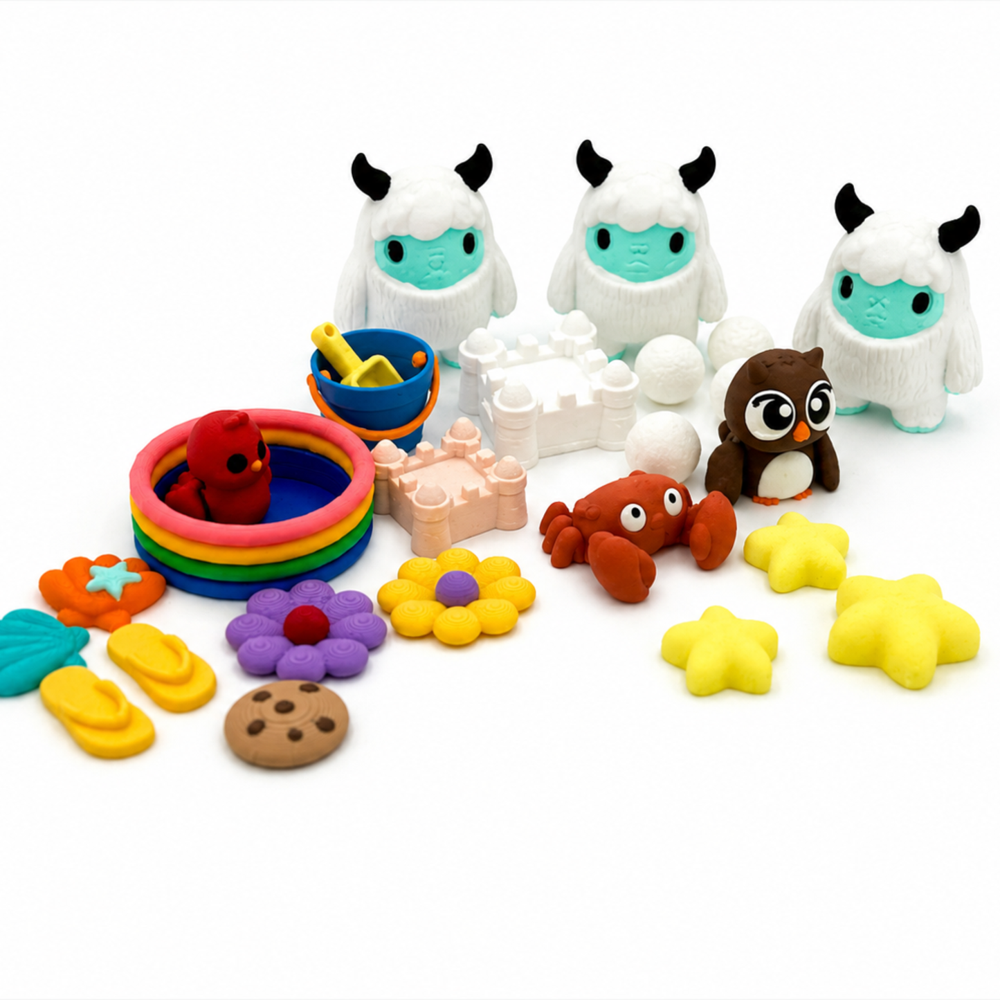 Yeti & Friends storybook sensory play set with three miniature yetis, beach toys, stars, owl, crab, flowers, and play accessories for elementary learning and small world play.