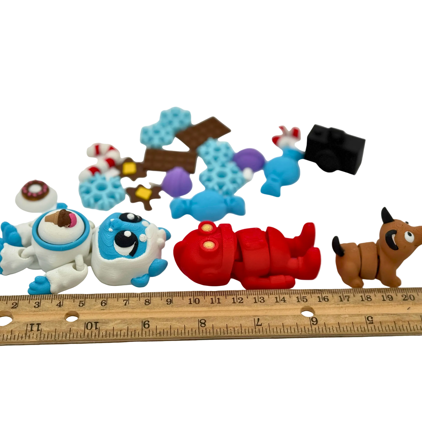 Articulated yeti with interchangeable tummy piece, robot, and dog figures from BriteBerry storybook character set designed for supervised learning play