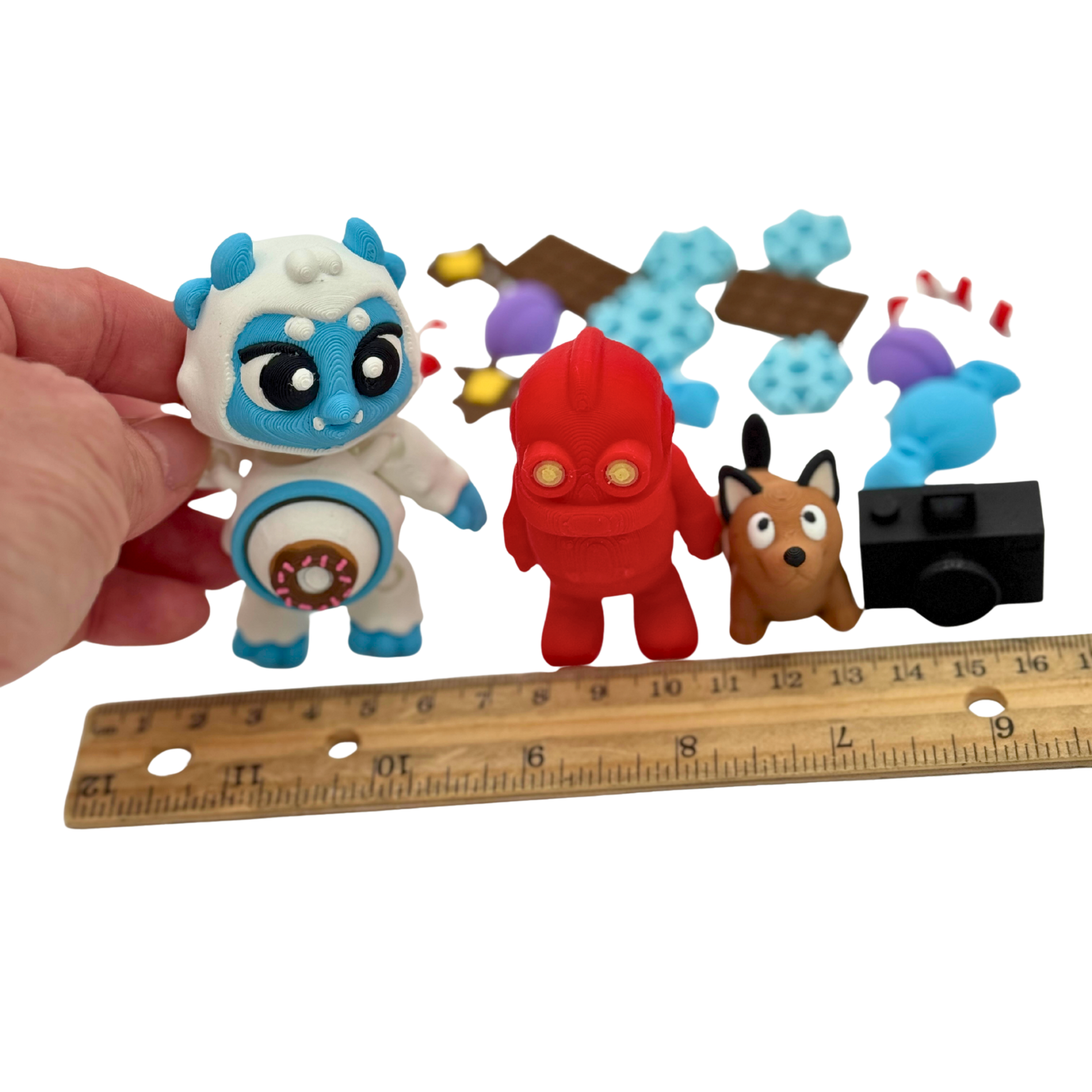 Articulated yeti with interchangeable tummy piece, robot, and dog figures from BriteBerry storybook character set designed for supervised learning play